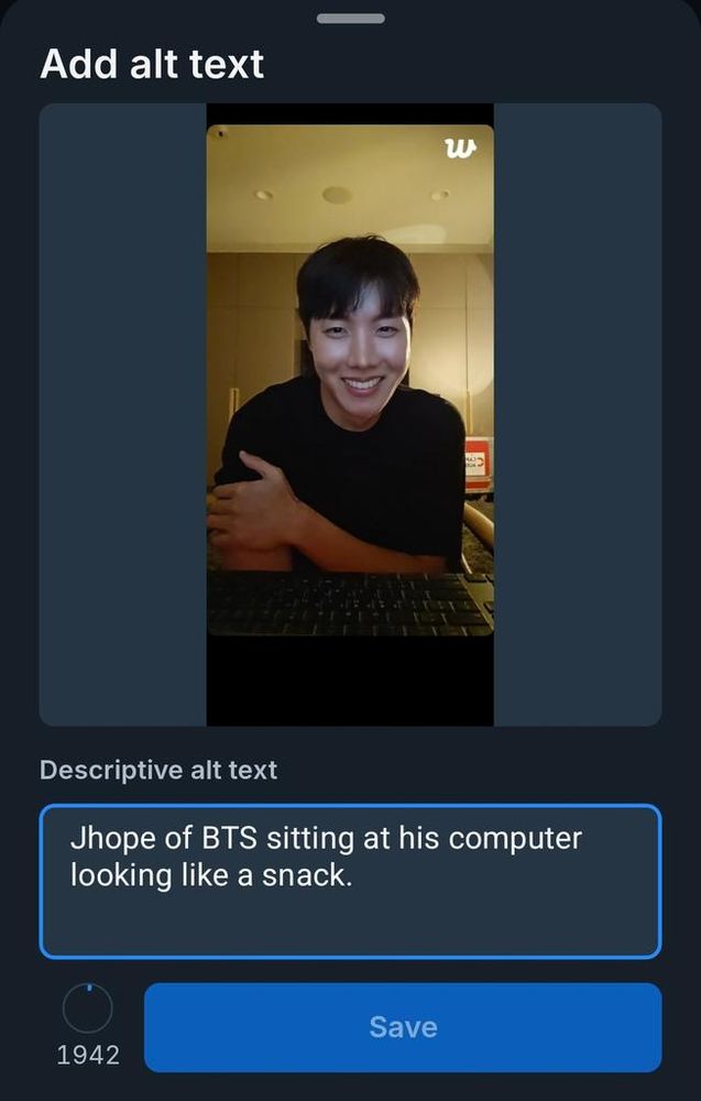 Screen shot of a picture of J-Hope of BTS, with the alt-text "Jhope of BTS sitting at his computer looking like a snack" displayed.