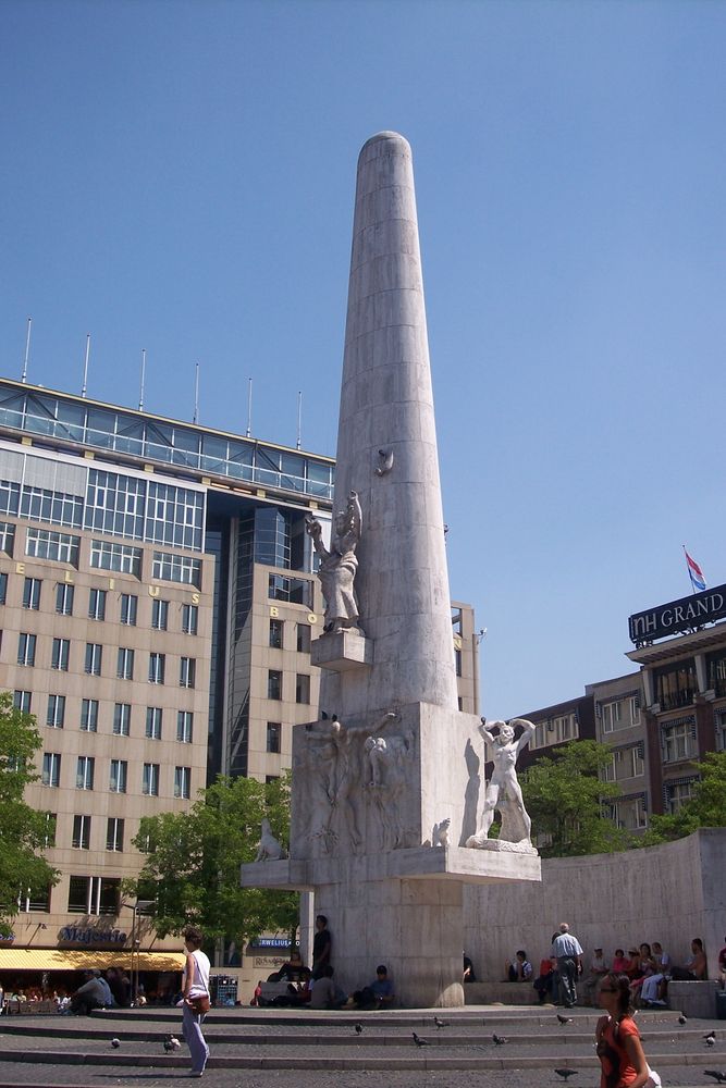 this 22-meter high stone obelisk serves as a memorial to the atrocities of world war II. the monument is made of white marble and features a series of sculptures. at the base of the monument, there are four figures representing war, peace, resistance, and mourning. there is a relief depicting a group of people, and in the middle of the monument, there is a sculpture of a woman holding a dove, symbolizing peace…
