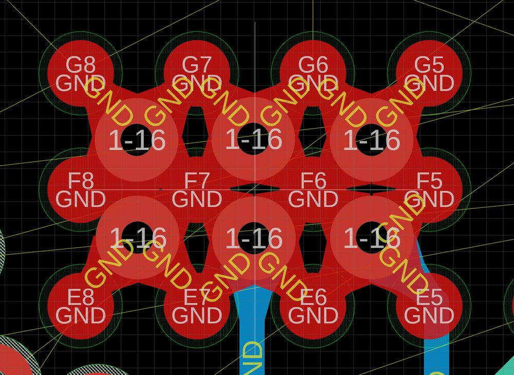 A set of vias and GND pads on a BGA part all connected together in a weird looking lump with many holes