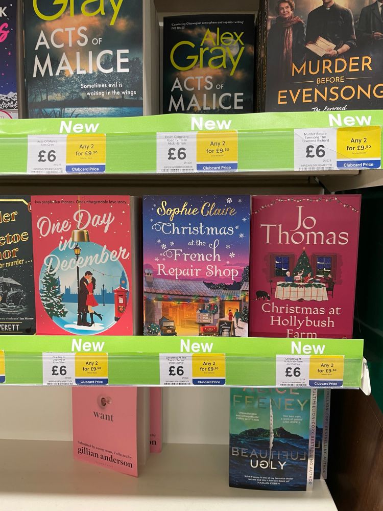 photo of new books in Tesco book aisle including Christmas at the French Repair Shop my Sophie Claire