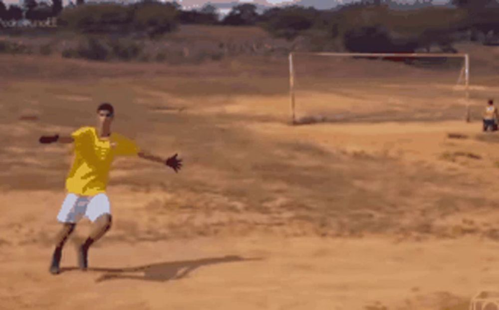 a man in a yellow shirt is standing in a field with his arms outstretched