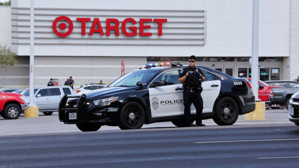 Police say two adults and a child have been killed in a shooting outside a Target store in Austin, Texas, and a suspect has been detained.
