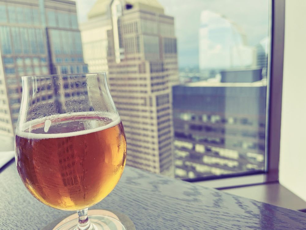 Glass of beer looking out the 52nd floor.