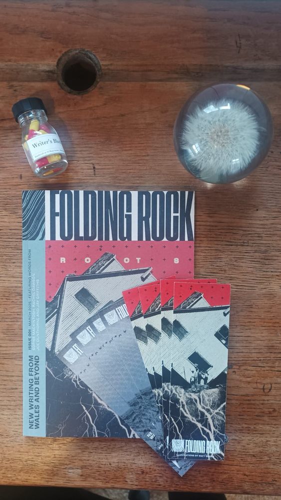 Folding Rock magazine with writers block pills and paperweight