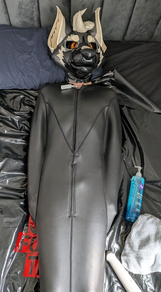 Rai in their rubber hood  in a sleep sack