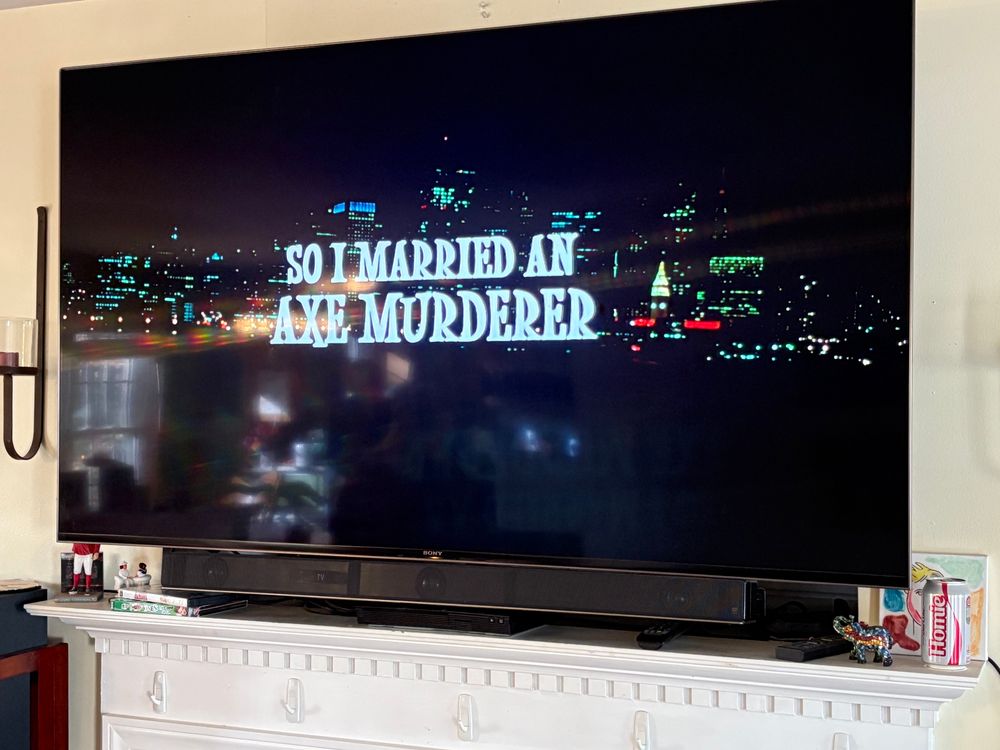 The title card of “So I Married an Axe Murderer” on a flatscreen TV.