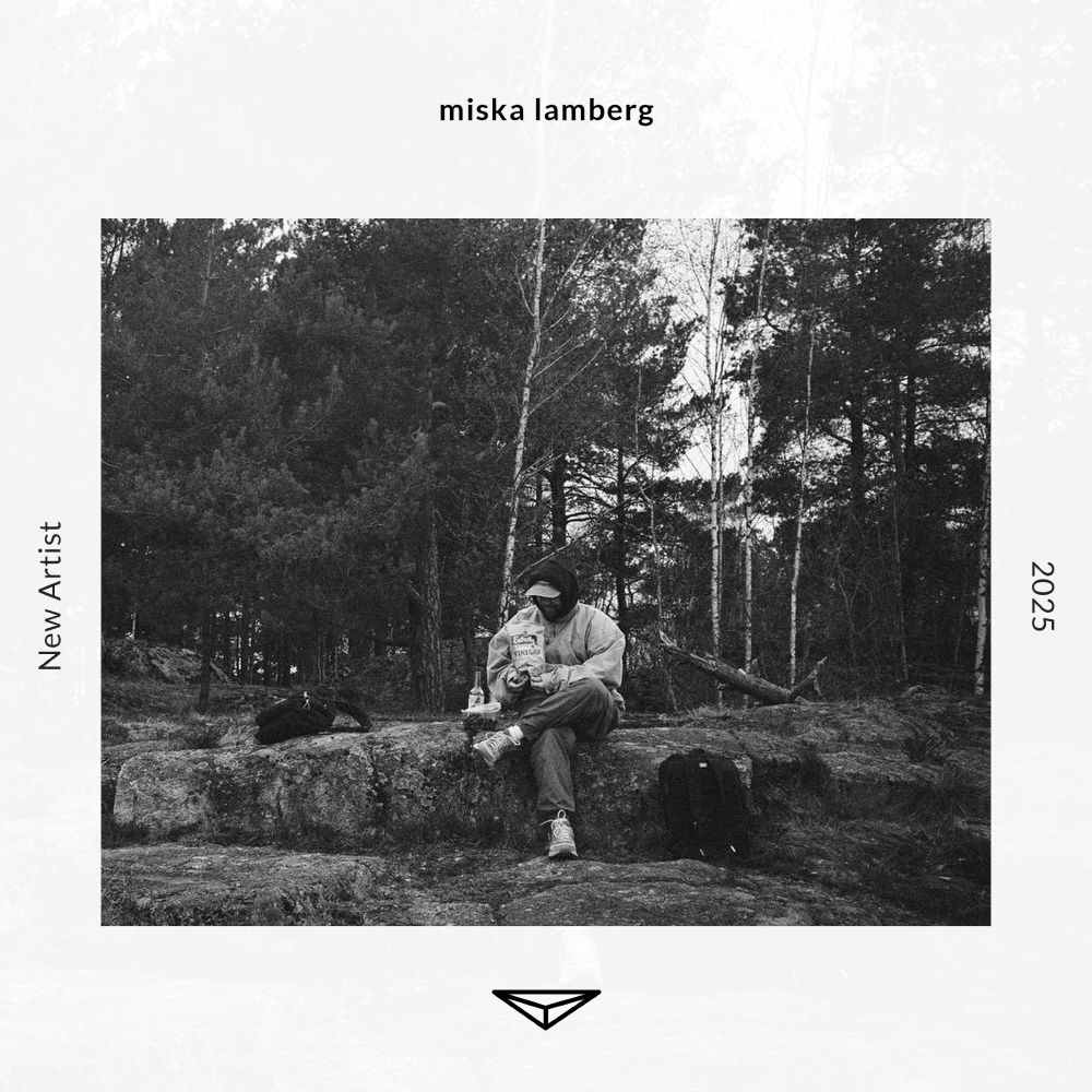 Light grey flyer with text on the top that reads “miska lamberg,” on the left it reads “New Artist,” on the right it reads “2025,” and has the triangular Dragon’s Eye Recordings logo at the bottom.  In the center is a photo of miska lamberg, the photo is black and white showing a them sinnting i a forent on some rocks with pine trees behind them, a backpack on either side of them and holding snacks with a bottle and graps next to them. They have a had on and hood up over the hat.