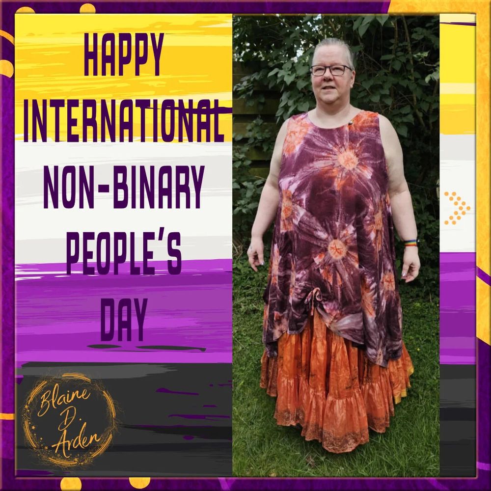 Blaine in a purple and orange tie-dye tunic and orange silk skirt stands outdoors. The image text reads, "Happy International Non-Binary People's Day," with Blaine D. Arden's logo in the bottom-left corner.