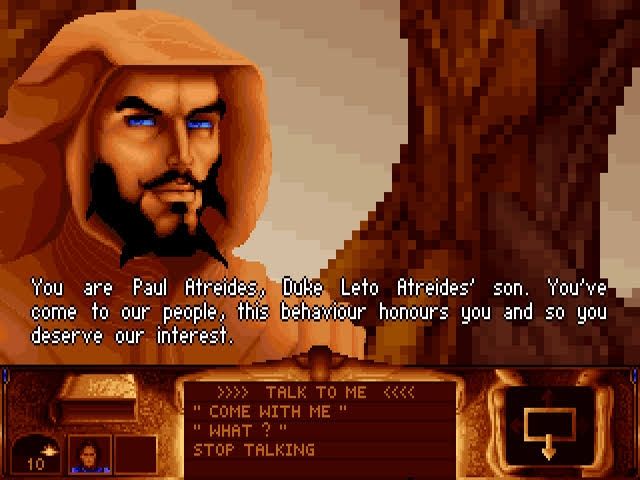 Screenshot du jeu "Dune" de cryo interactive de 1992.
On y voit stilgar de face qui dit "you are Paul atreides, duke Leto atreides' son. You've come to our people, this behaviour honours you and so you deserve our interest." En bas de l'écran différentes réponses possibles : "talk to me" 
"Come with me"
"What ?" Et "stop talking"