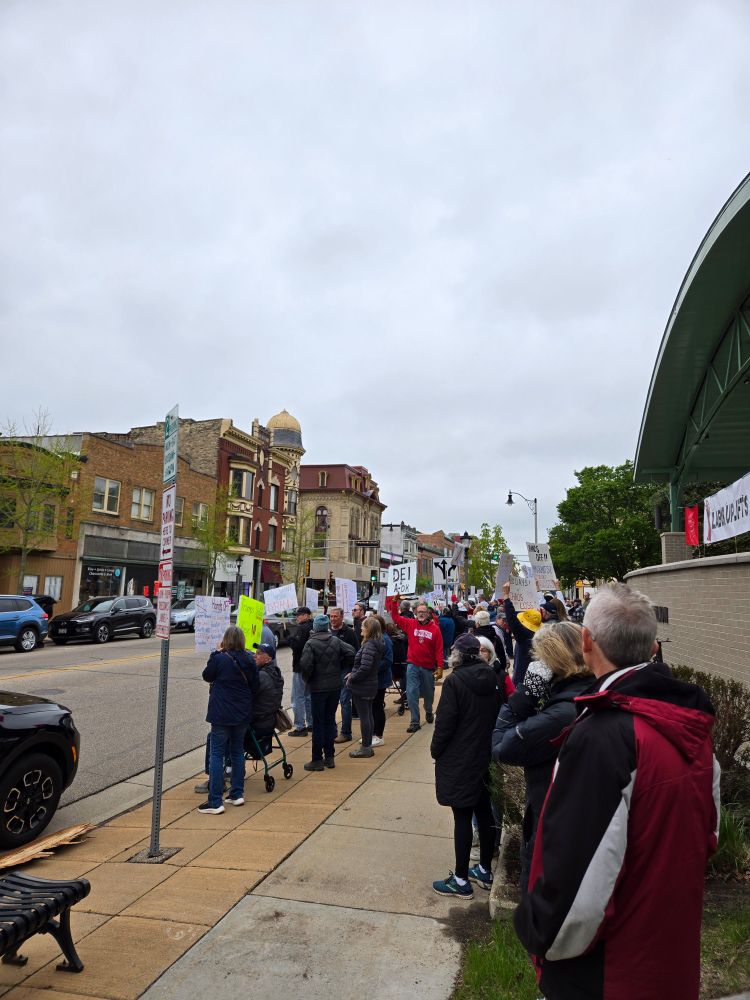 Crowd of protesters with signs. 