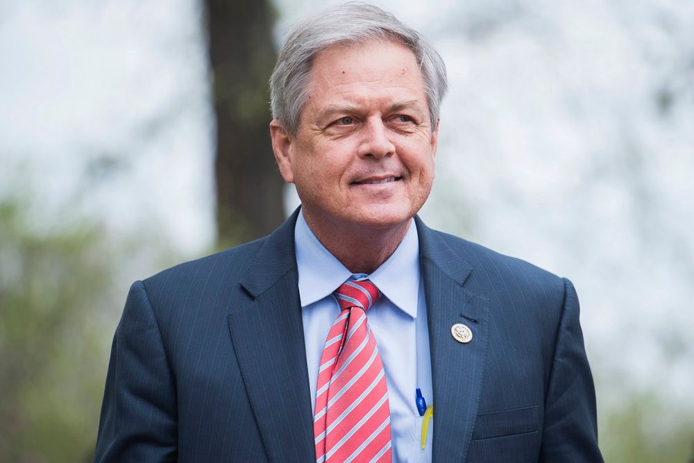 Ralph Norman in a suit and tie smiling (perhaps thinking about all the constituents whose healthcare and food he just denied)