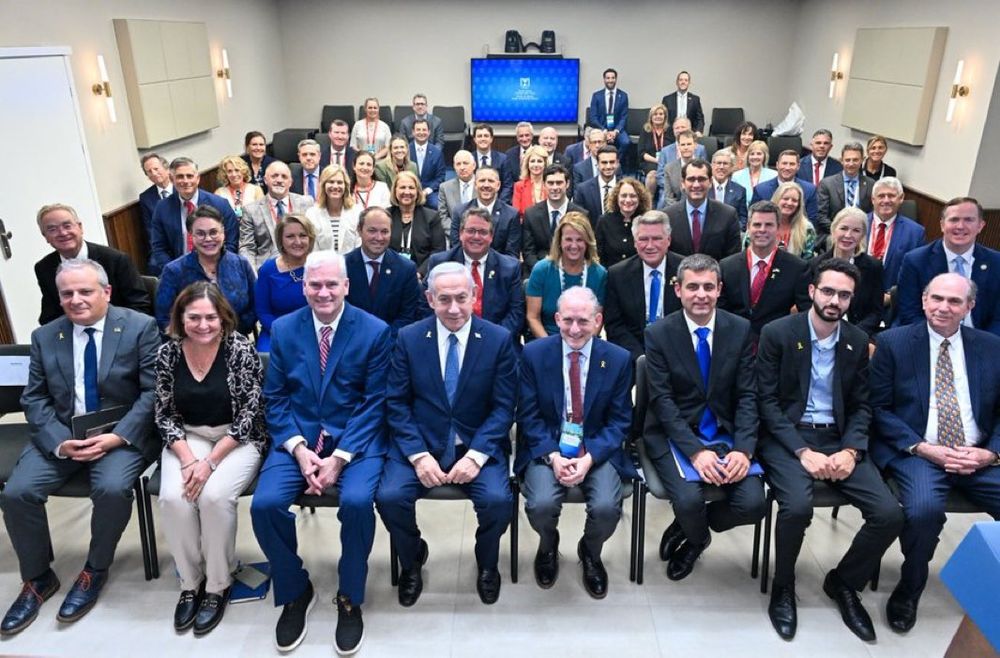 Prime Minister Benjamin Netanyahu meets in Jerusalem with a group of Republican lawmakers on an AIPAC organized trip, August 6, 2025. A group of around 70 men and women are all seen smiling broadly with Netanyahu in the middle (Kobi Gideon/ GPO).
