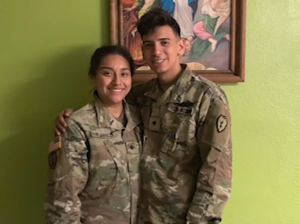 George Retes pictured smiling in his US Army uniform with his arm around his wife, Guadalupe, who is also in Army uniform