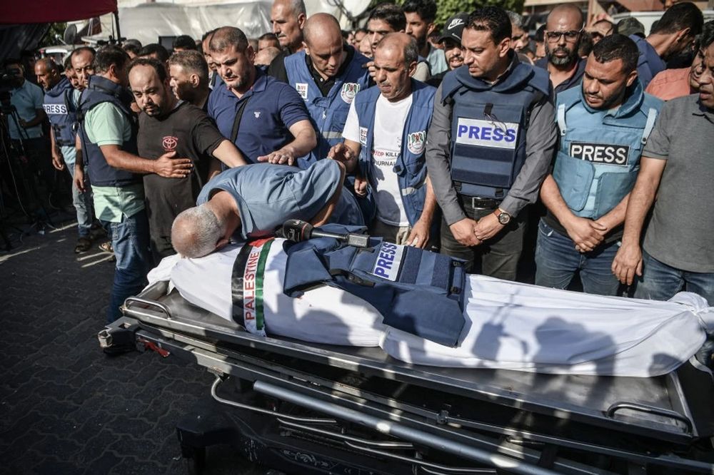A funeral ceremony is held for Palestine TV correspondent Mohammed Abu Hatab, who was killed, along with his family members, in an airstrike on his home in Khan Yunis, Gaza on November 3, 2023 (Photo: Abed Zagout/Anadolu via Getty Images)