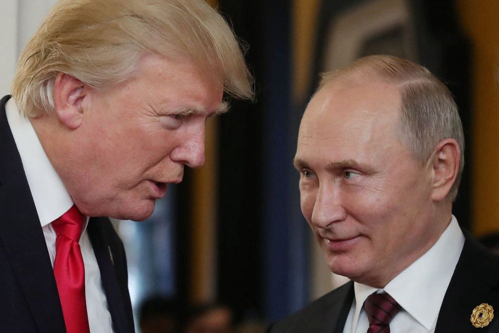 Trump and Putin have a very cosy chat together. Trump is speaking bad Putin is smiling towards him.
