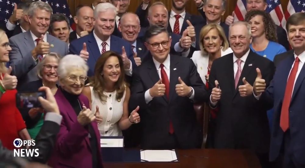 A photo of Speaker Johnson surrounded by GOP members all smiling broadly with their thumbs up, just after passing a Bill which strips healthcare, food nutrition and school meals from some of the most vulnerable families in America.