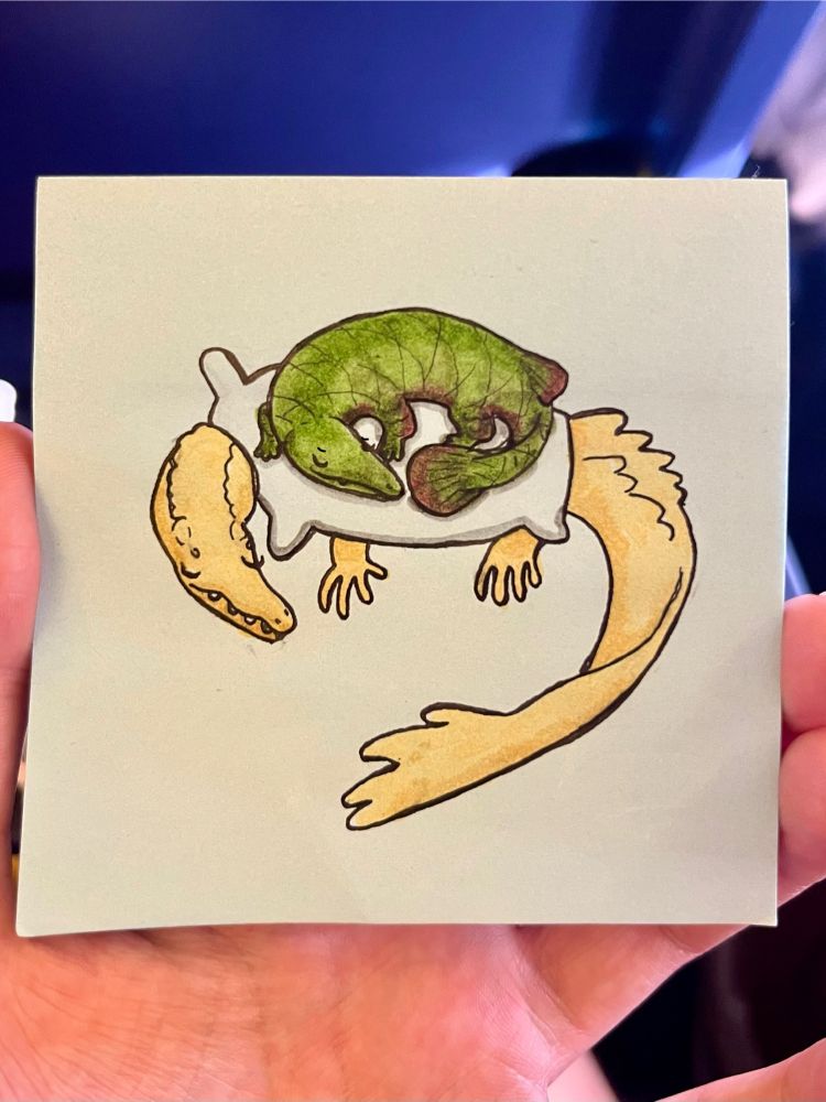 Post it note coloured pen and ink drawing of an alligator gar with legs sleeping peacefully on top of a cream alligator with a pillow body.