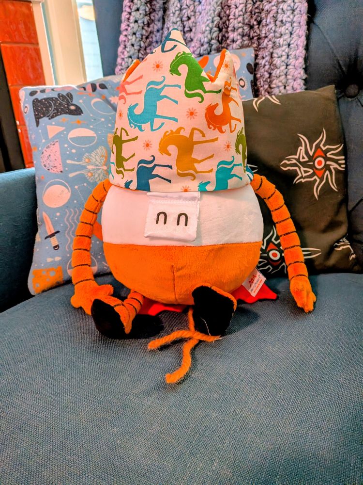 A photo of an AD-HD stuffed animal wearing a fabric crown