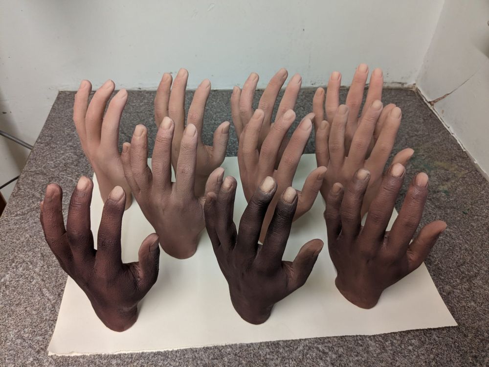 rubber hands with different skin tones