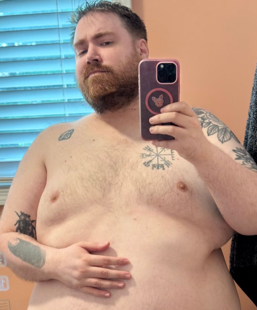 Shirtless mirror selfie in the bathroom showing off my big tummy and nice beard. 