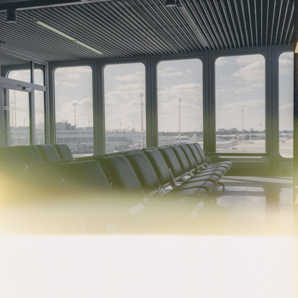 Airport terminal gate. Photograph on a wrong wound film resulting in exposed carrierpaper and therefore the bottom quarter appering with light leak kind of damage.