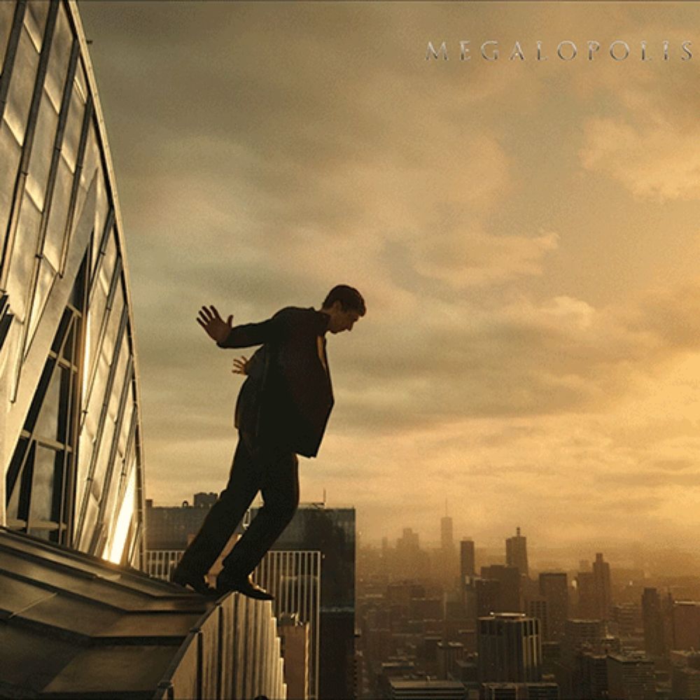 a man in a suit is standing on the edge of a building with megapolis written on the top