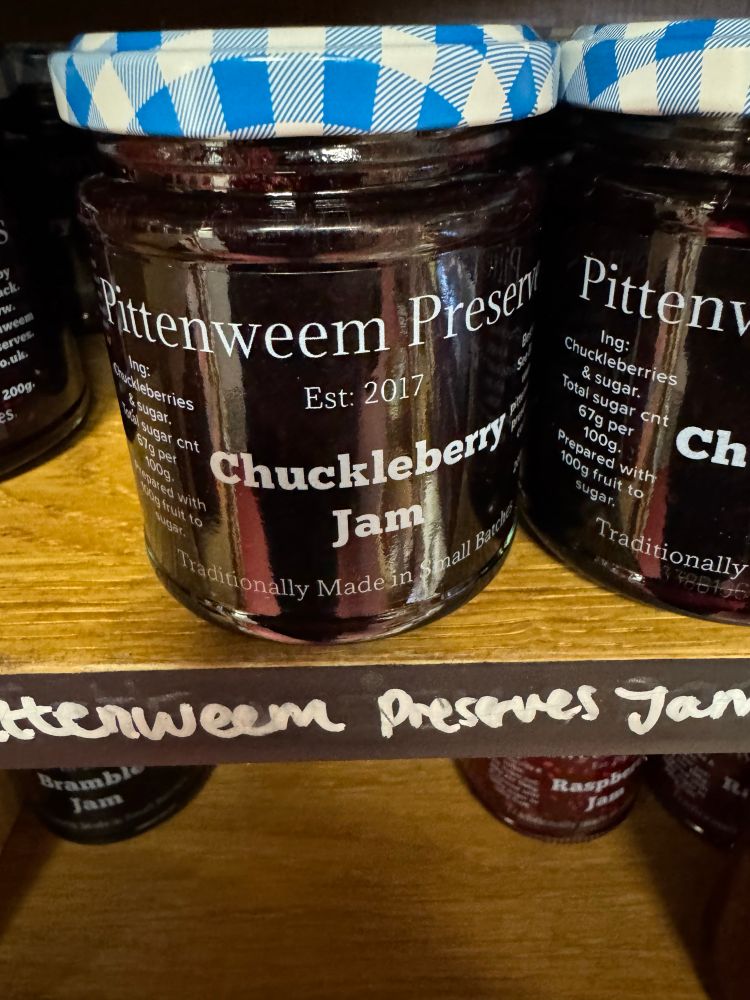 A photo of a jar of jam and the label says Pittenweem Preserve Chuckleberry Jam. 