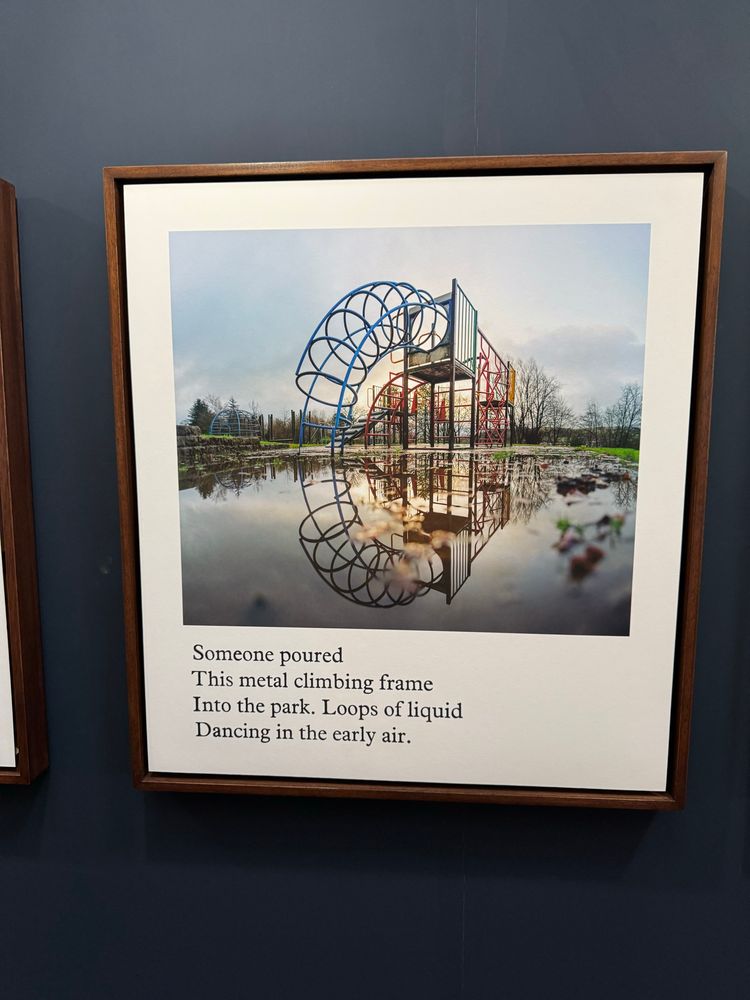 A photograph of a playground with puddles creating amazing reflections of the playground equipment. 