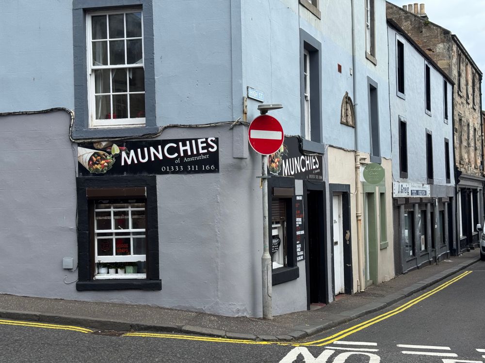 A photo of a corner shop in Anstruther. The sign reads "Munchies of Anstruther". 
