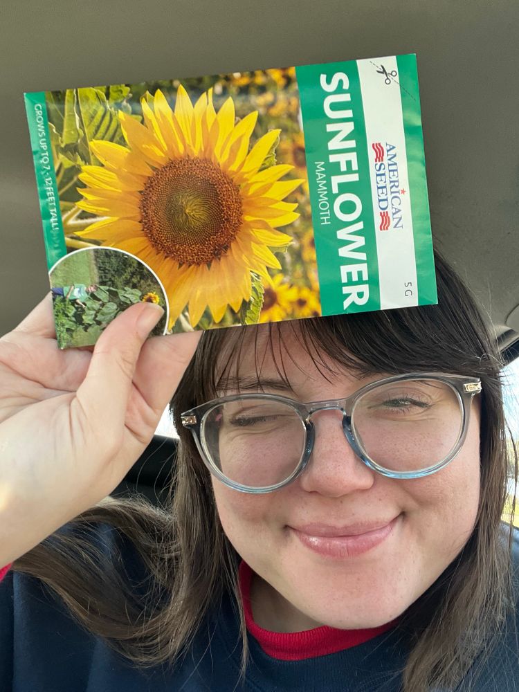 Clare holding sunflower seed