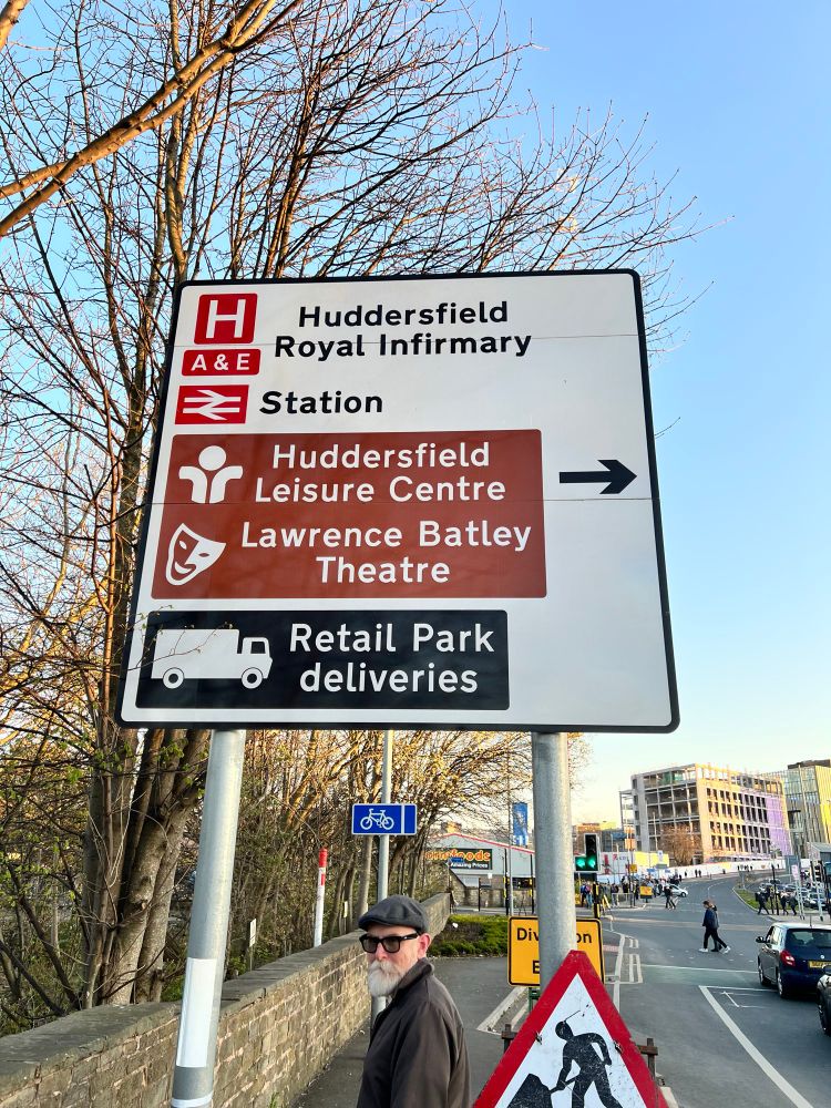Photo of a road sign featuring the Lawrence Batley theatre