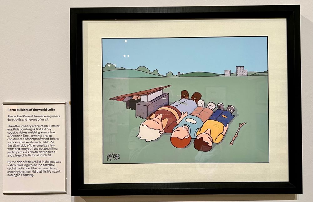 Painting of three kids and a stick lying in front of a makeshift ramp, waiting for their mate on a bike to successfully jump over them (hopefully).