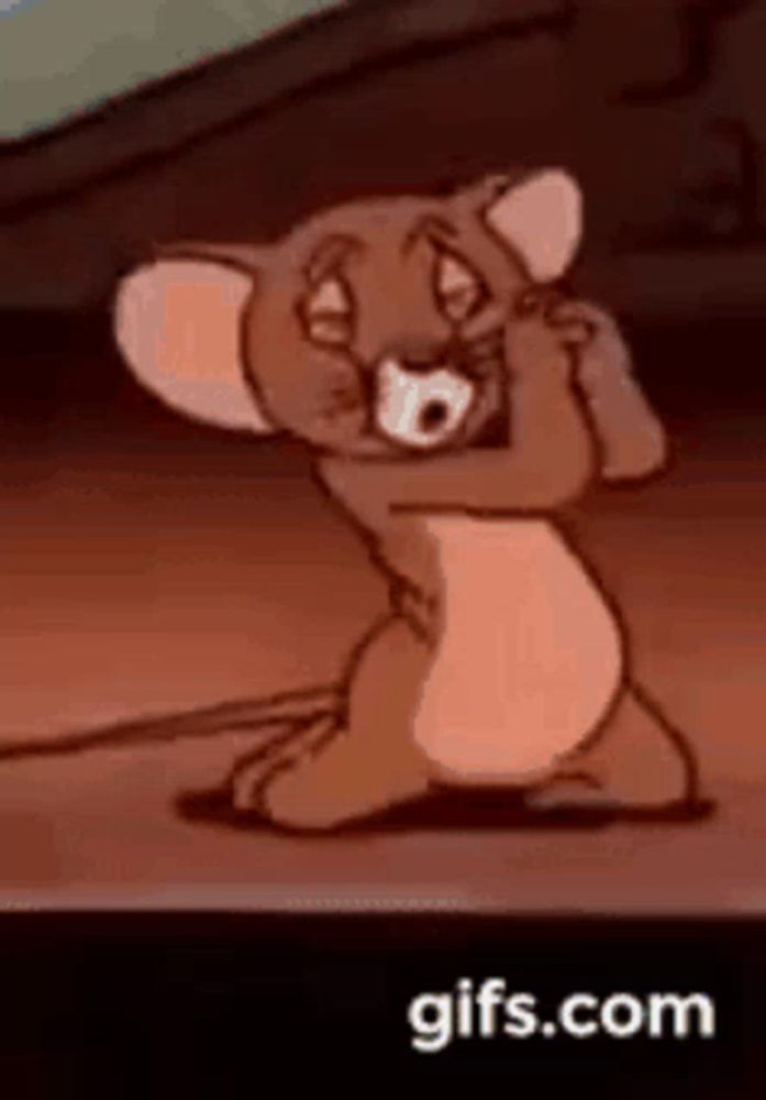 jerry from tom and jerry is covering his ears with his hands .