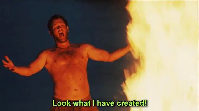 tom hanks in castaway, shirtless, standing in front of a large bonfire as he shouts "look what i have created!"