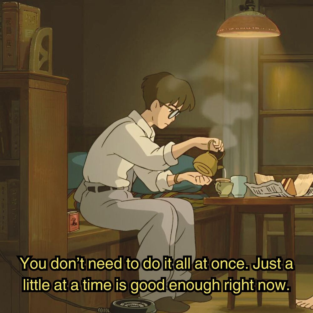 jiro from the movie the wind rises, sitting at a table, pouring some tea with a sandwich on the desk, and the room is softly lit with dim glowing light as he's alone in peace. the image is captioned "You don't need to do it all at once. just a little at a time is good enough right now."