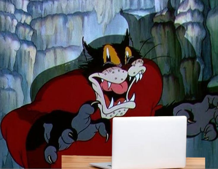 an image of a cartoon cat standing in front of a desk with an open laptop on it. The cartoon cat is standing, writhing its face into an expression of shocked agony and looks terrified to have been caught in the middle of the night with a light shining in its face.