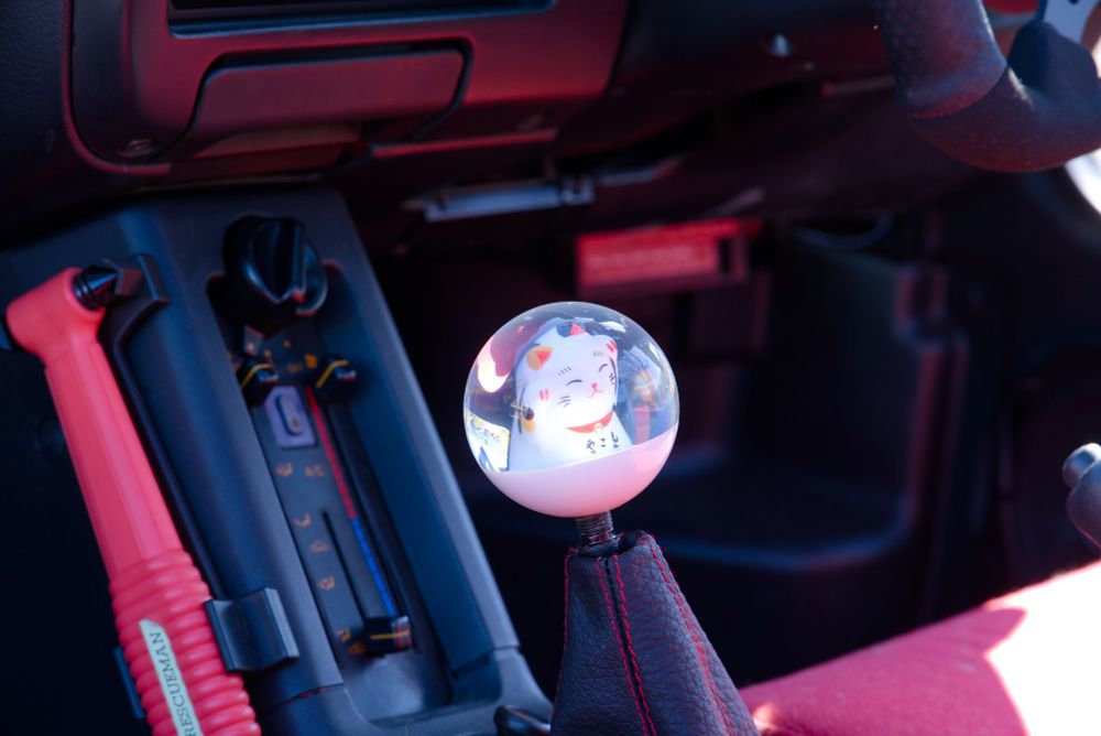 the interior of the AZ-1, with a kitty shifter ball