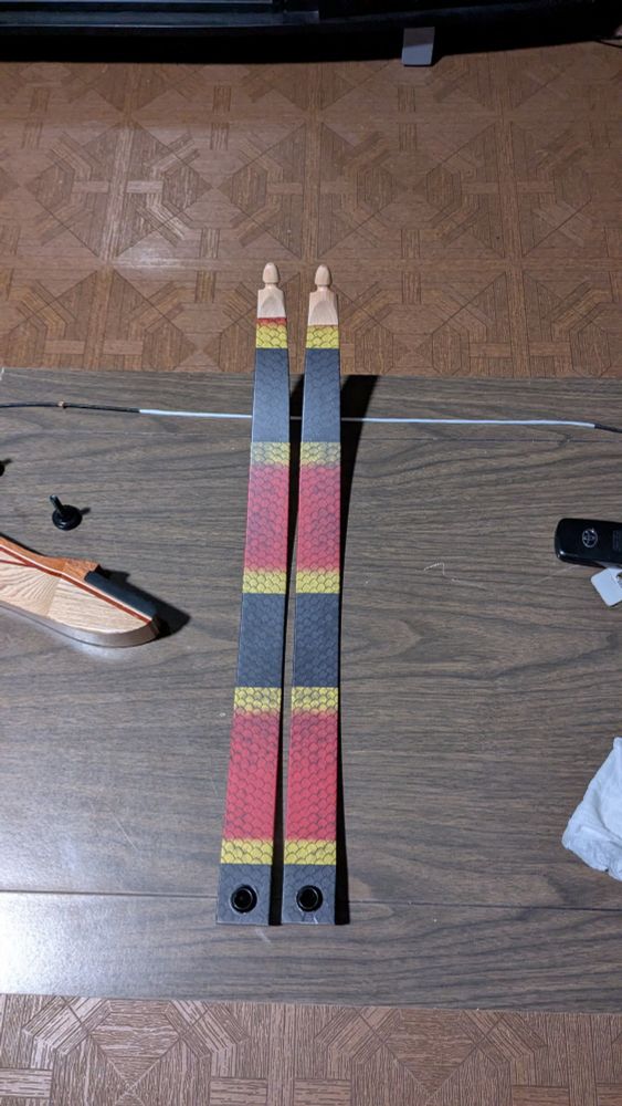 Set of recurve take-down limbs sporting a coral snake skin pattern 