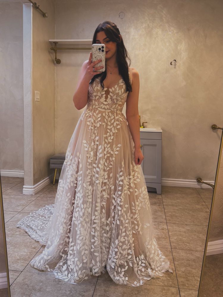 bee wearing her wedding dress from the past weekend