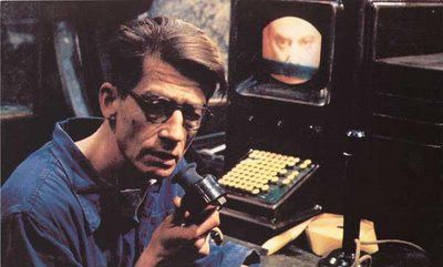 Screen shot:  Winston Smith from 1984, in his cubicle, altering history