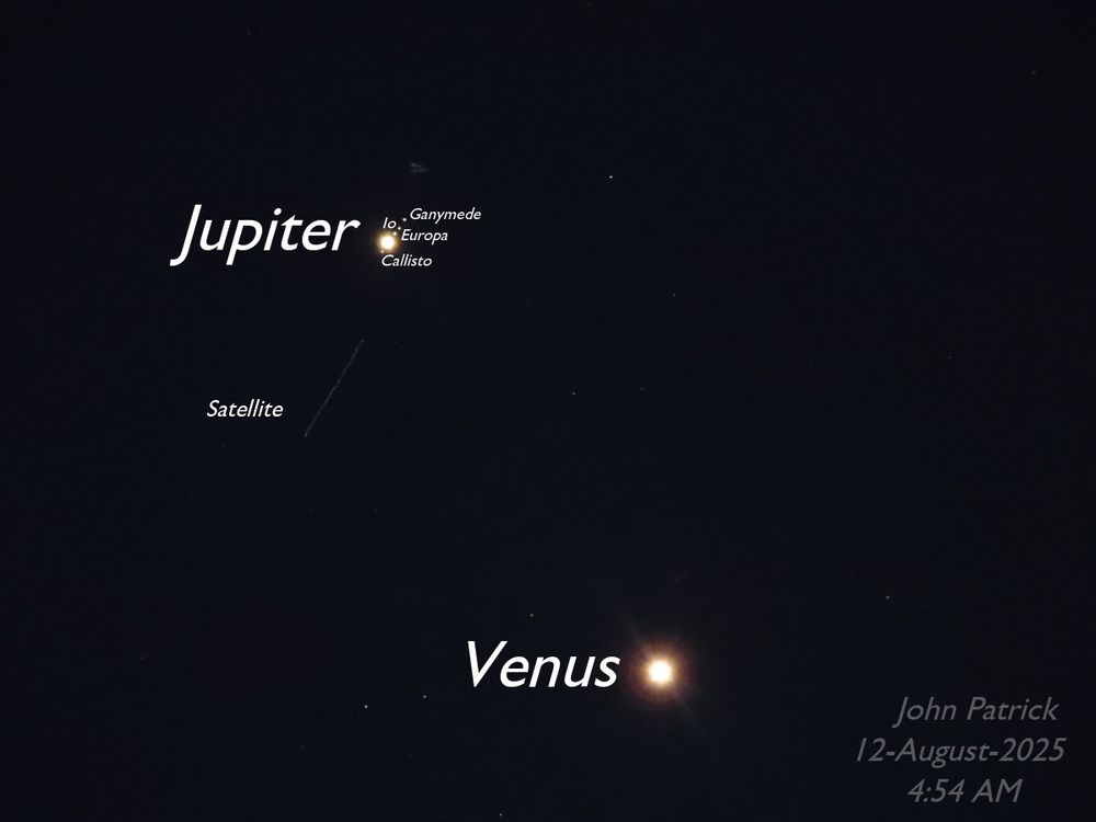 2 of 2 (same as the first but now with labels!)
Photo: A black background with whitish dots of various sizes.  The largest dot, in the lower right is the planet Venus.  A slightly smaller dot in the upper left is the planet Jupiter. There are four tiny dots very close on either side of Jupiter (three above, one below) forming a diagonal line from bottom left to upper right.  They are Jupiter's Galilean moons - (from bottom to top: Callisto, Europa, Io, and Ganymede.   Below and to the left of Jupiter is a long diagonal line created by a passing satellite. There are other tiny dots scattered through the photo, they are stars.