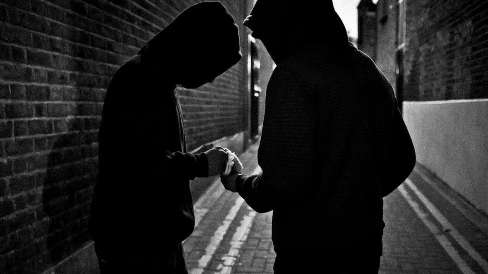 Me and my game dealer making a trade, cold hard cash in exchange for cold hard plastic. 