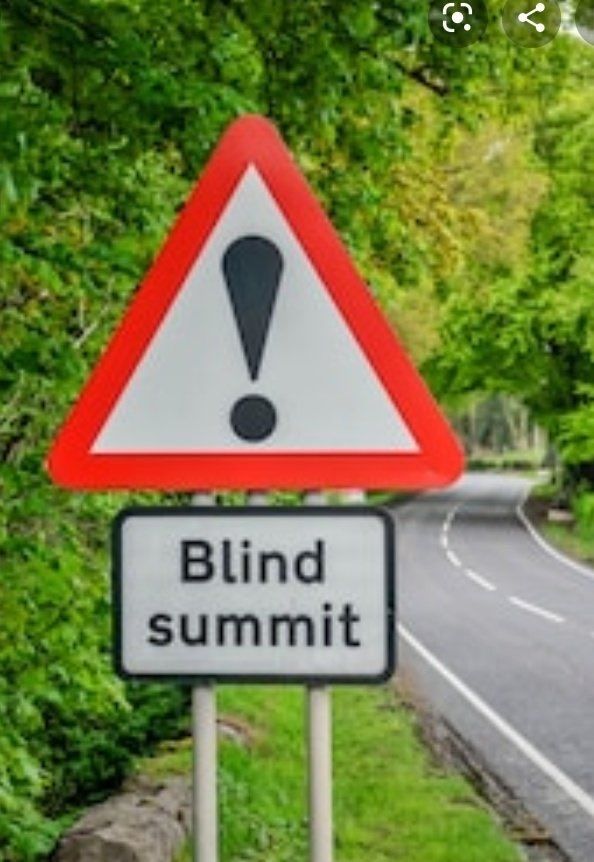Blind summit sign