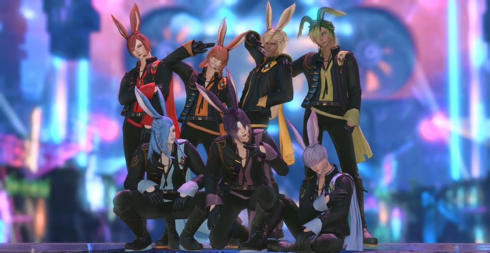 An all male viera, bunbois, boyband pose in solution nine wearing the colors of the rainbow.