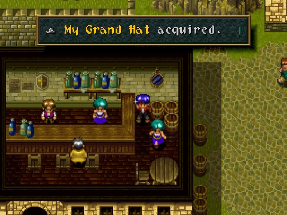 The picture shows a screenshot from Wild Arms on the Playstation. Main character Rudy stands inside of a pub while holding up a newly found item. The textbox above him says "My Grand Hat acquired".