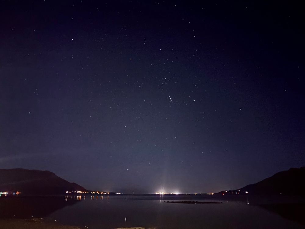 Carlingford Lough on a bright winters night, the tide is mostly out but still reflecting the light from a star