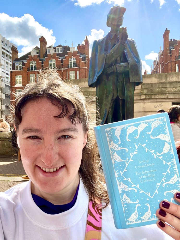 Statue of Sherlock Holmes and book