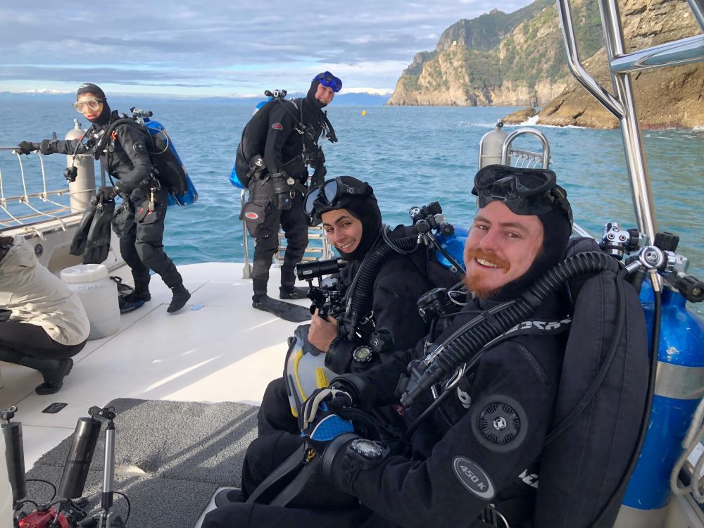 Claudia and the scientific diving team of the Marine Zoology Lab on a zodiac, ready to jump into the water with all their diving and sampling equipment