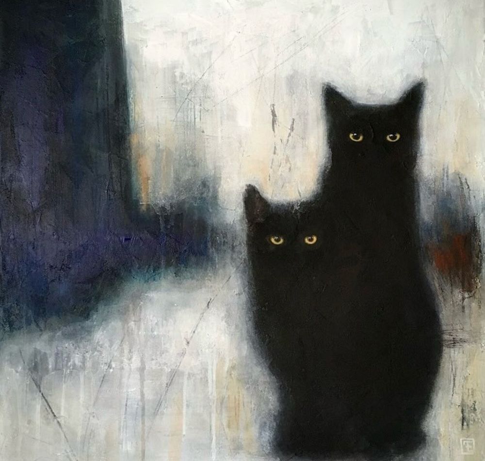Two black cats against an abstract background 
