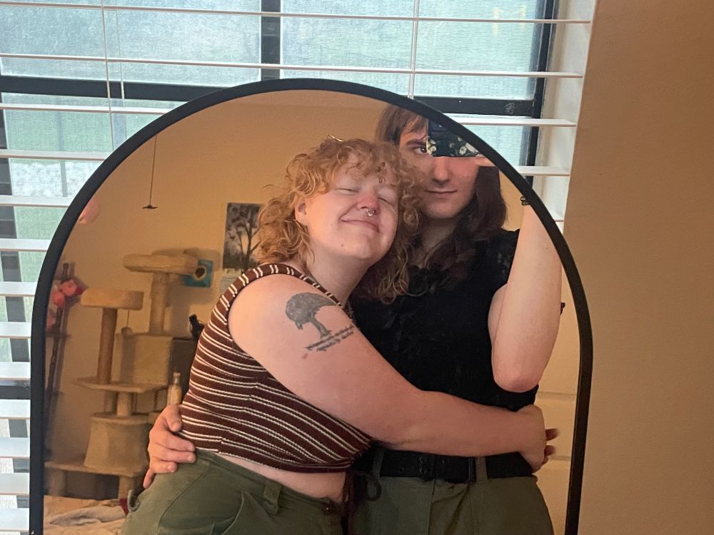 mirror pic of Sunny holding serena by the waist 